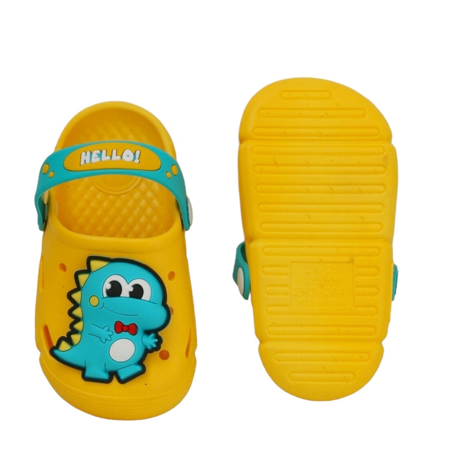 Yellow dino clogs for boys by Yellow Bee shown with toys, perfect for playful outfits.