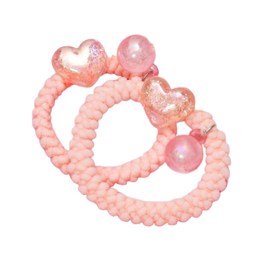 Assorted colors of Yellow Bee soft braided pink  rubber bands with pearls and glittery charms, ready to style any hair type.