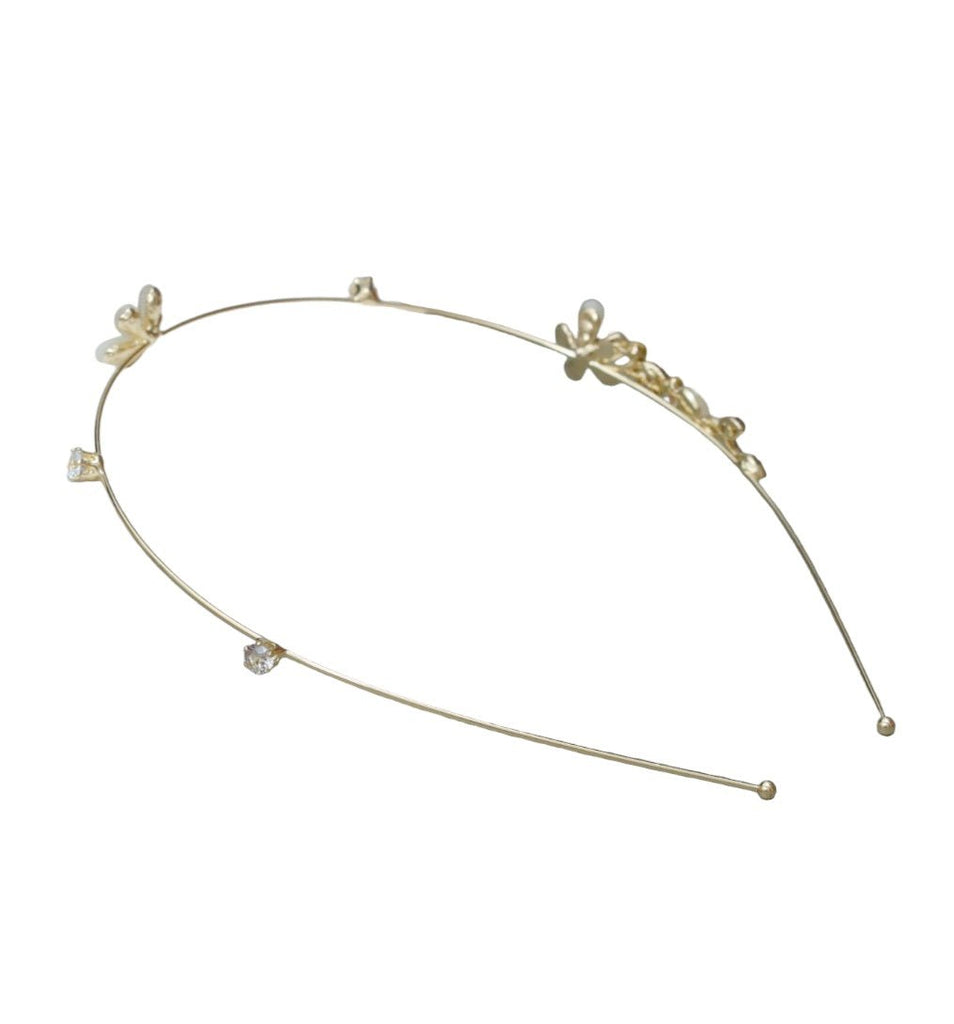 Decorative Yellow Bee hairband showcasing the intricate design of golden metal and white acrylic flowers.