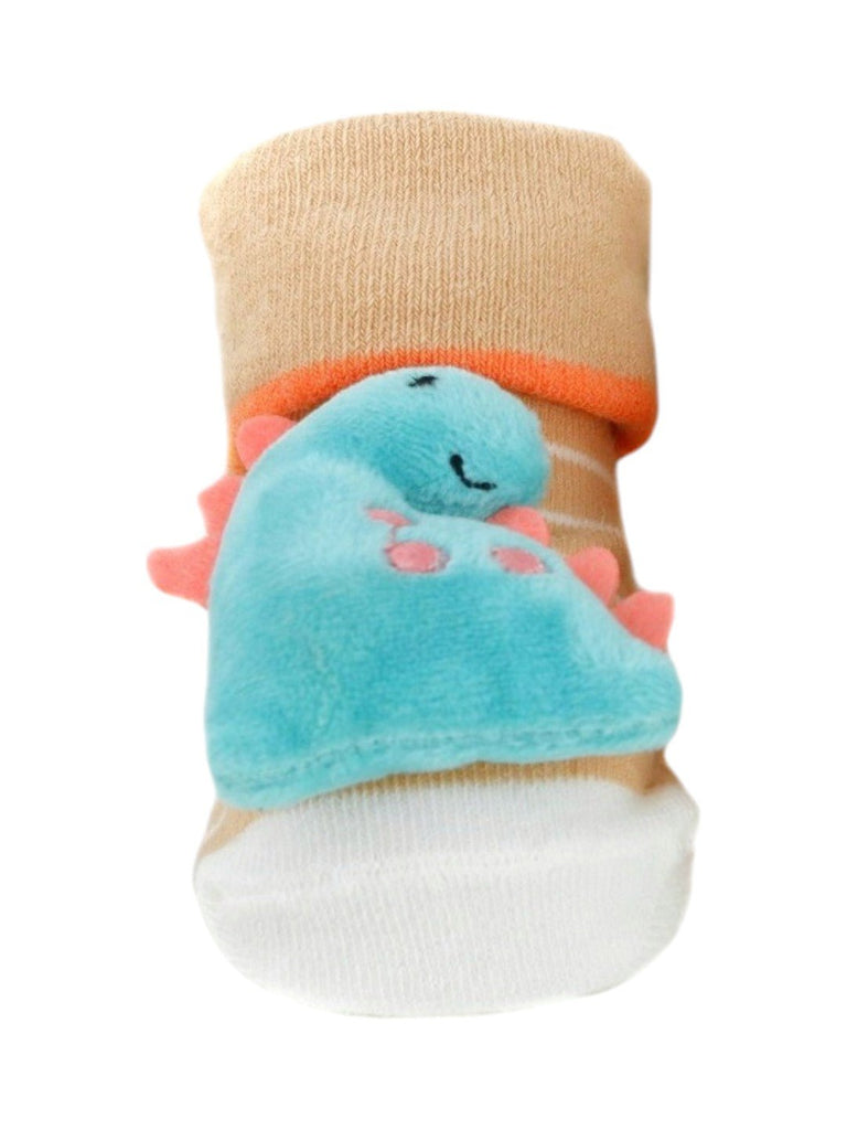 Closeup of baby socks featuring a smiling plush dinosaur with pink accents and tan-striped socks.