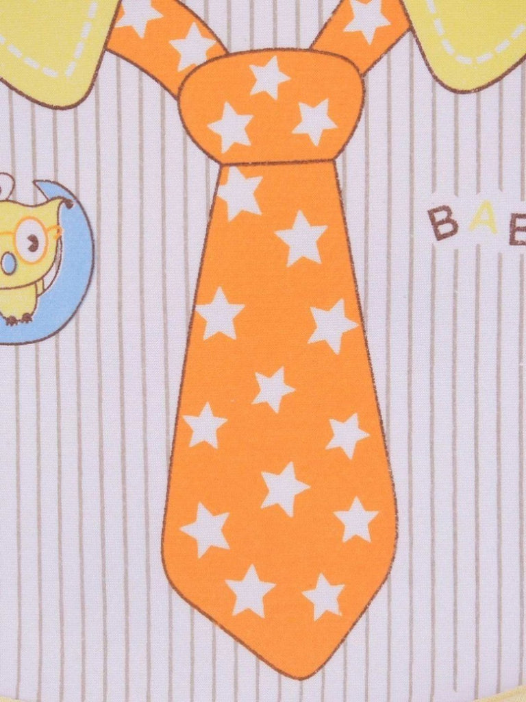 Close-up view of the Yellow Bee Sunny Day Tie Baby Bib highlighting the star pattern and tie detail.