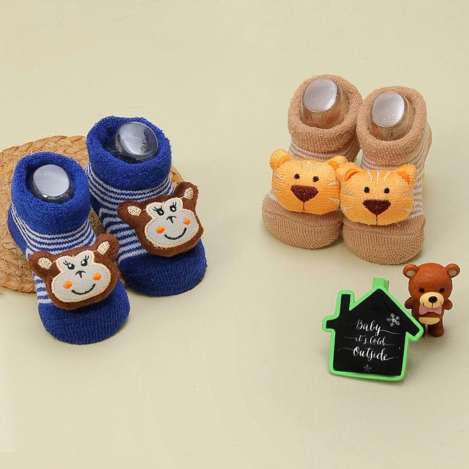 Display of Yellow Bee's blue and brown animal stuffed toy socks for boys in a pack of two.