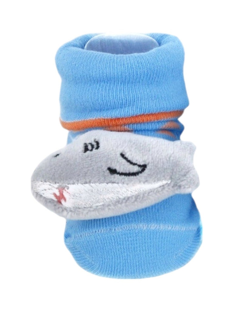 A close-up view of the plush shark detail on the baby socks.