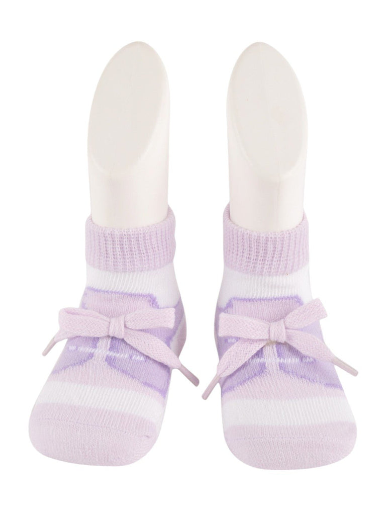 Close-up details of the front design of baby’s purple ballet style socks with bow accent.