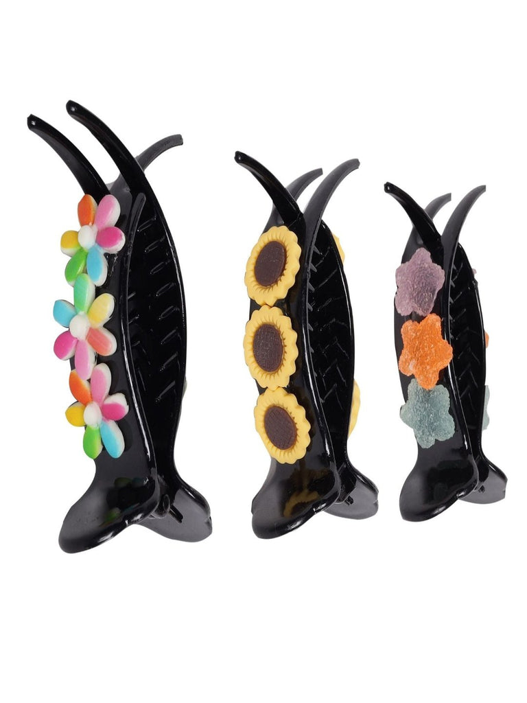 Pack Of 3 yellow Bee's Banana Hair Clutcher creatively displayed with flower and star decorations.