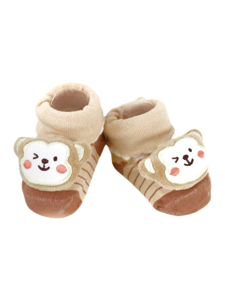 Side view of beige baby booties featuring a cute 3D monkey design, ideal for daily wear.