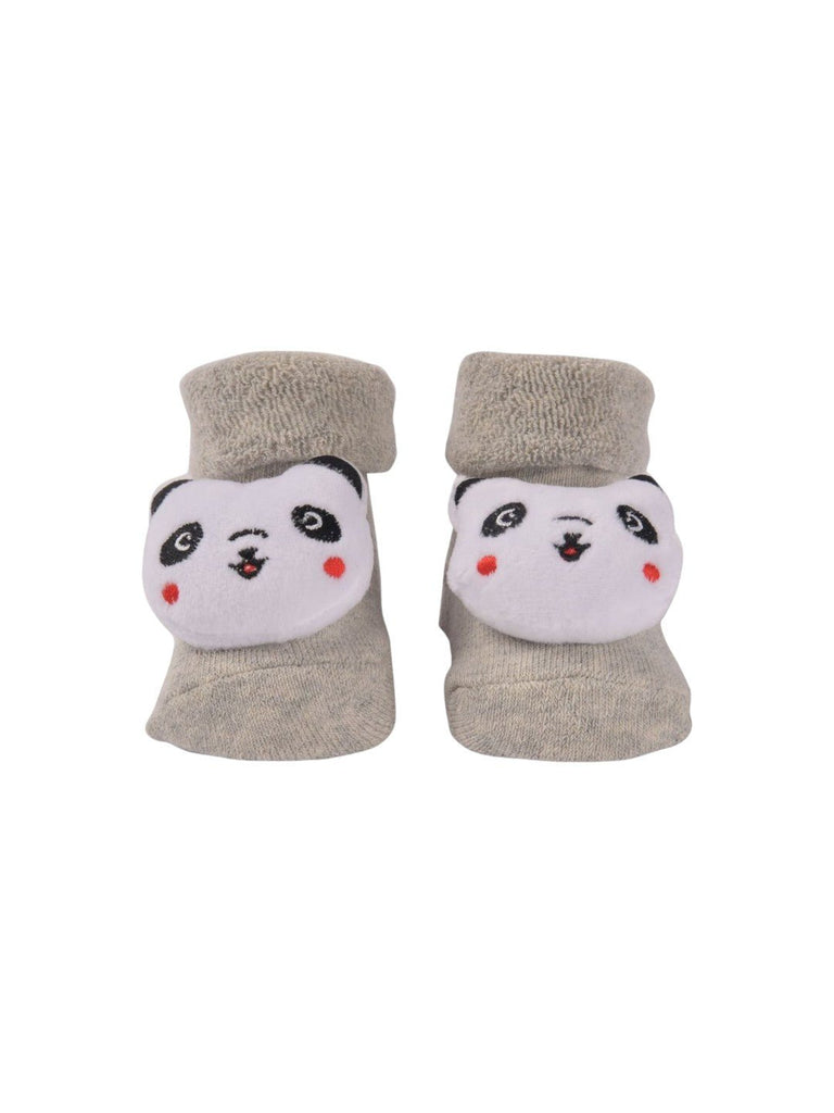 Front view of beige baby booties with 3D panda face design.