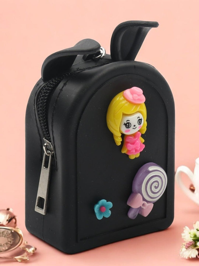 Creative display of Black Bunny-Eared Coin Pouch with a cute doll and candy design, shown with additional props.