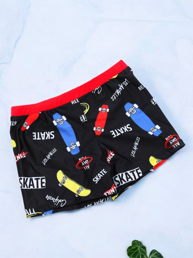 Black Skateboard-Themed Swim Shorts with Bold Red Accent