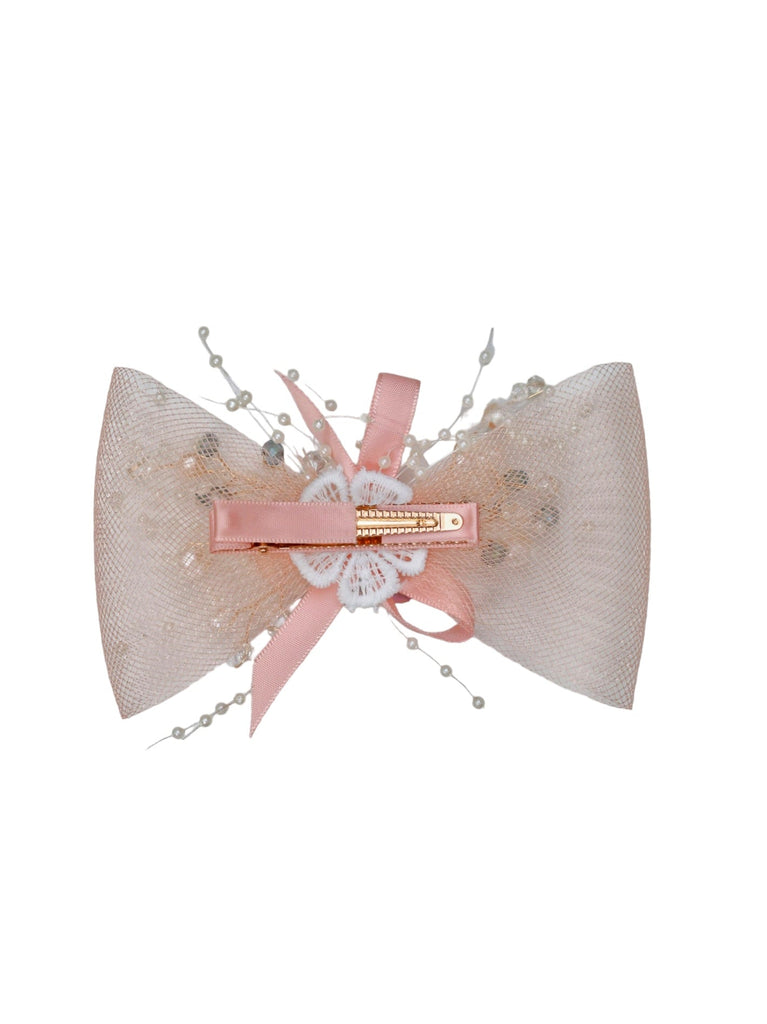 Back view of Yellow Bee's peach embellished net bow hair clip showing the secure alligator clip.