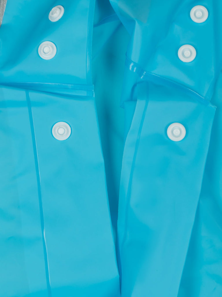 Close-up view of boys' blue space explorer raincoat detailing button closures and hood.