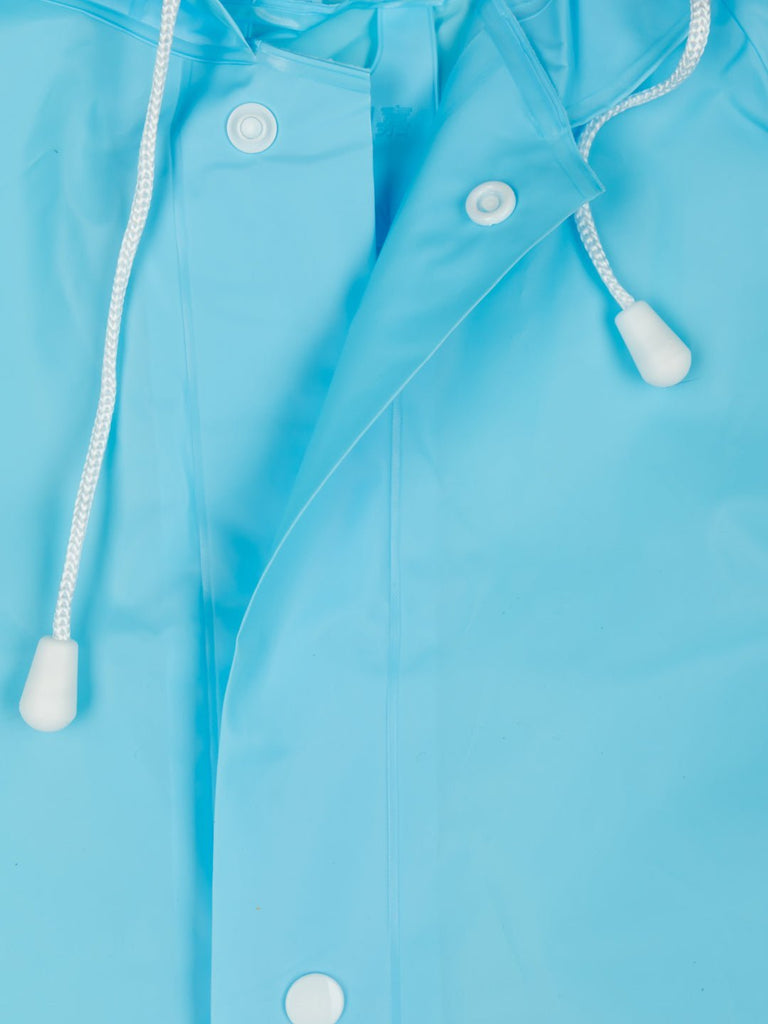 Close-up of the button closure and fabric detail on the boys' sky blue dino astronaut raincoat.