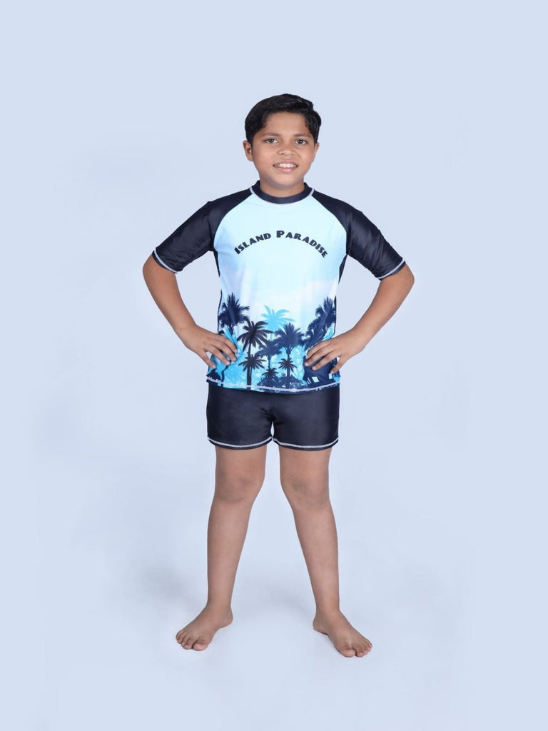 Boy Posing in Yellow Bee's Boys' Swim Set with Island Paradise Print