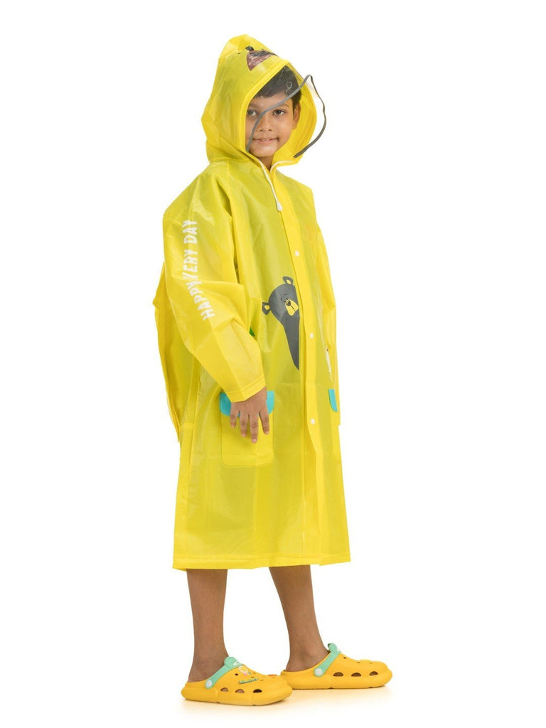 yellow bee adventure raincoat with bear hood and playful print side view.