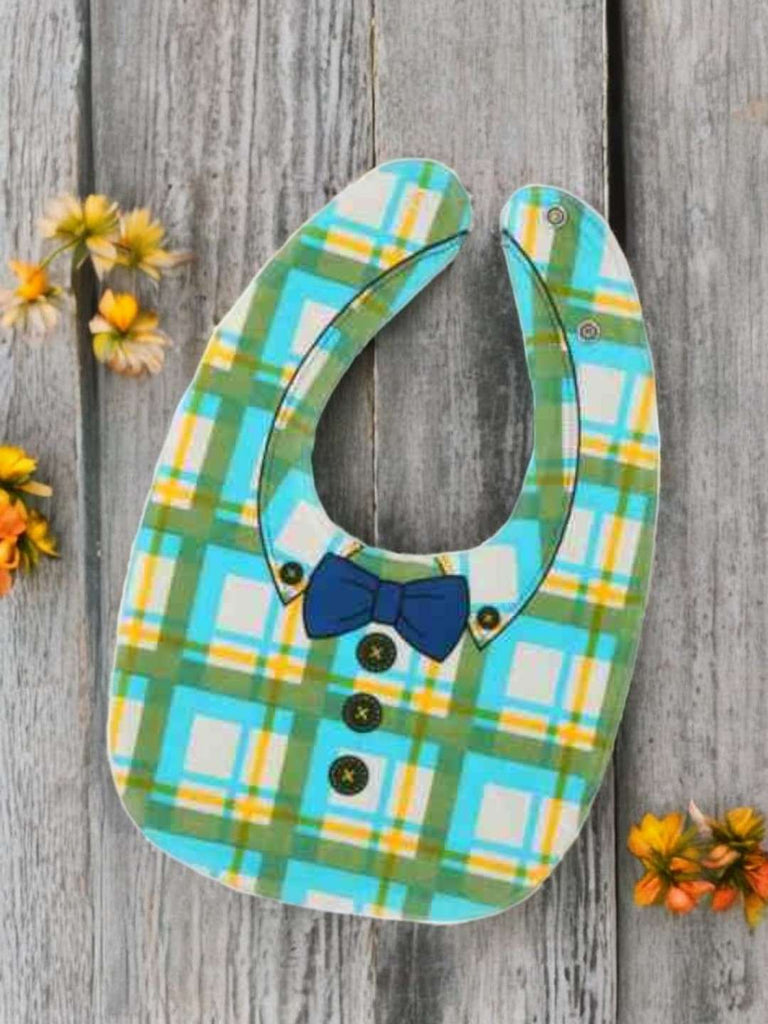 Creativity display view of Yellow Bee silicone baby bib with bright check and bow tie, ideal for boys.