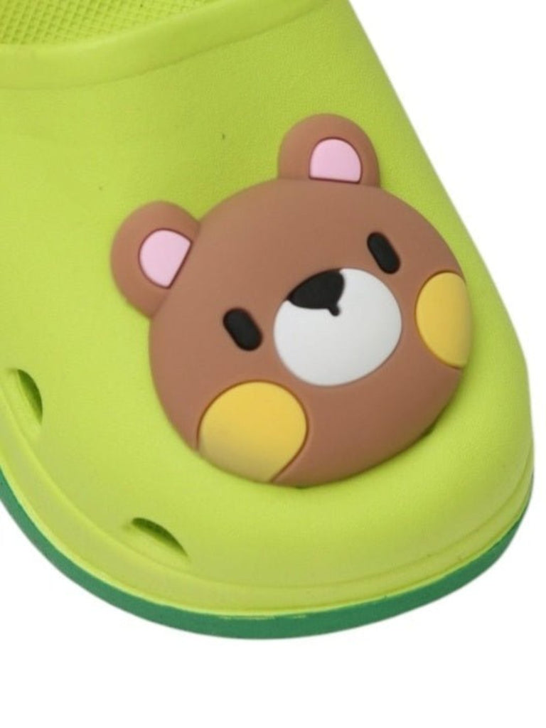 Close-up view highlighting the bear face and vibrant green color on the clogs.