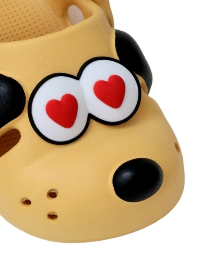 Close-up view of the puppy face on Yellow Bee's Bright Yellow Puppy Love Clogs, emphasizing the heart-shaped eyes and details.