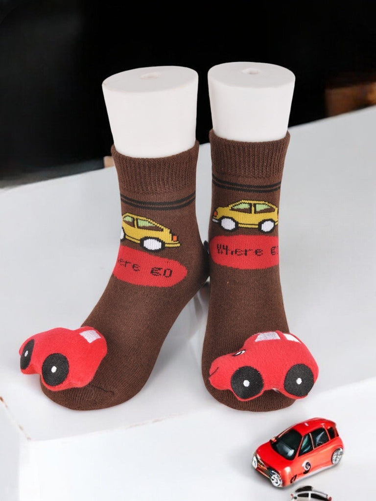 creative view Brown toddler socks with a bright car stuffed toy and 'Where to?' text design.