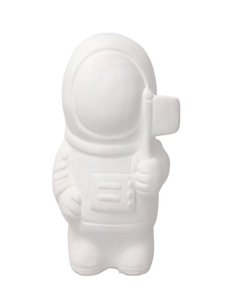 Close-up view of the unpainted astronaut ceramic figure.