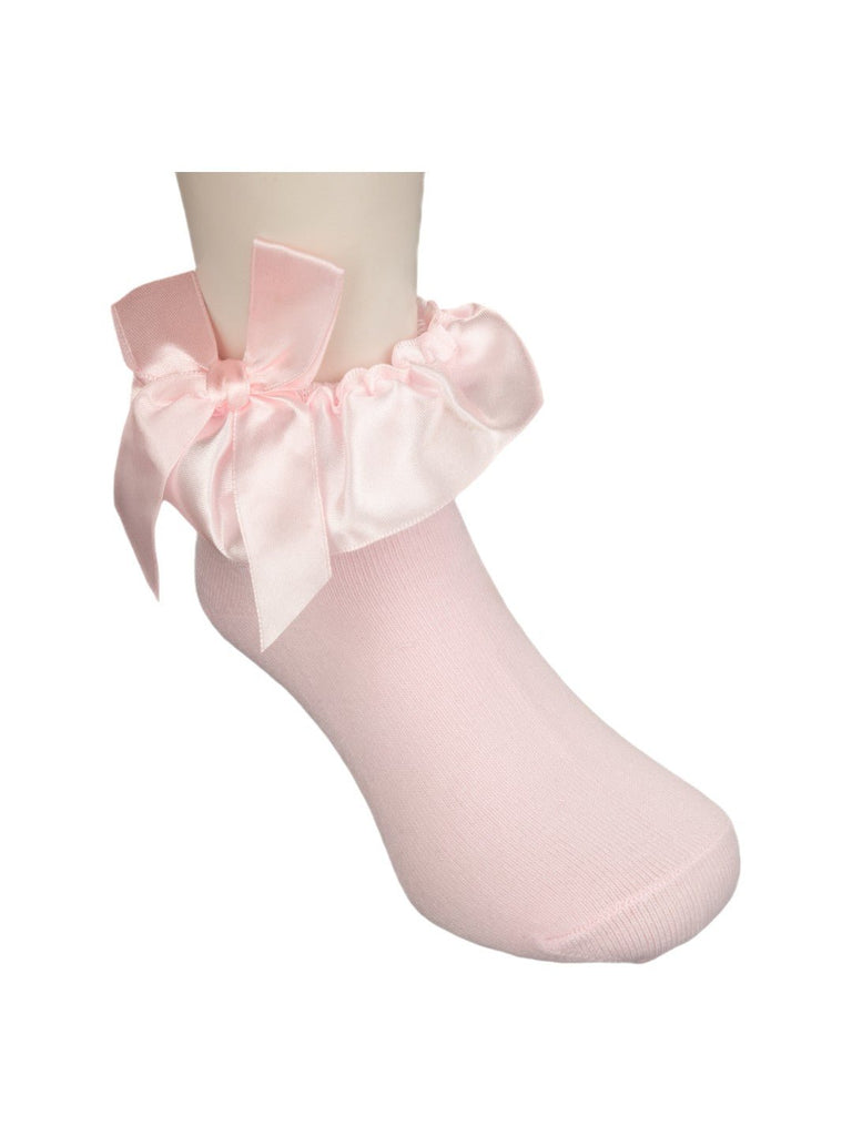 Pink baby sock with satin bow, shown from the side with a focus on the bow detail.