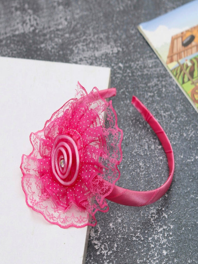 Creative view of the charming fuchsia baby hairband with lace ruffles and satin flower accent by Yellow Bee