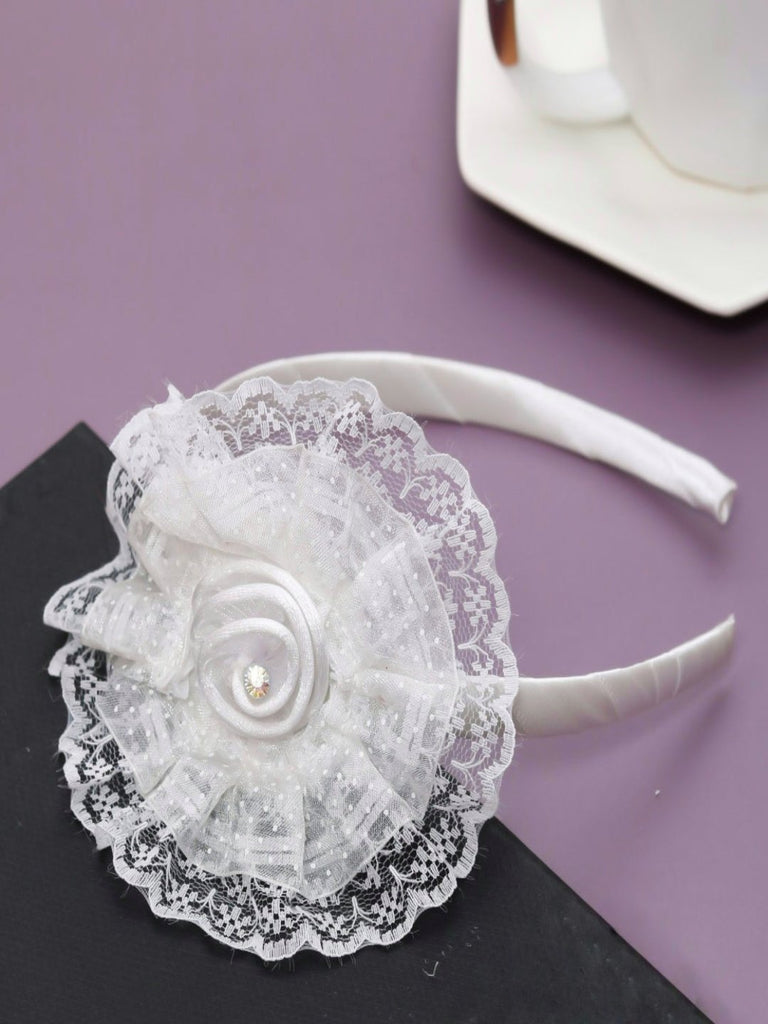  Creative view of the charming white lace baby hairband with satin flower and sparkling gem accent by Yellow Bee.