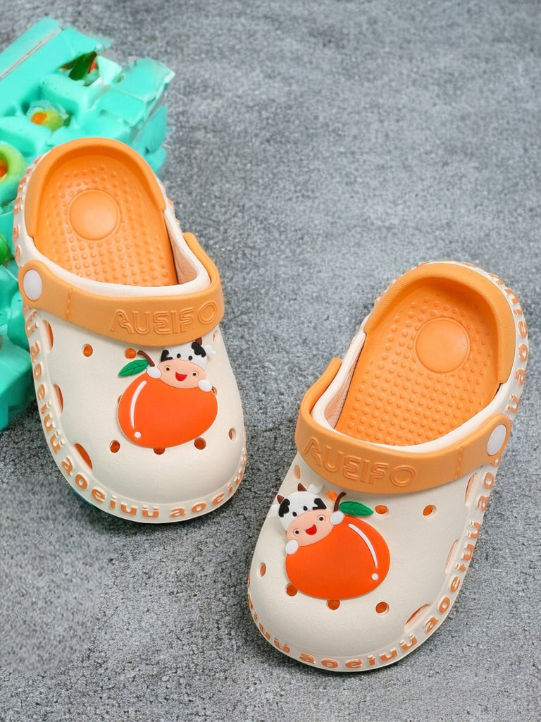 Beige kids' garden sandals with a cute cow and orange fruit design and a comfy footbed...