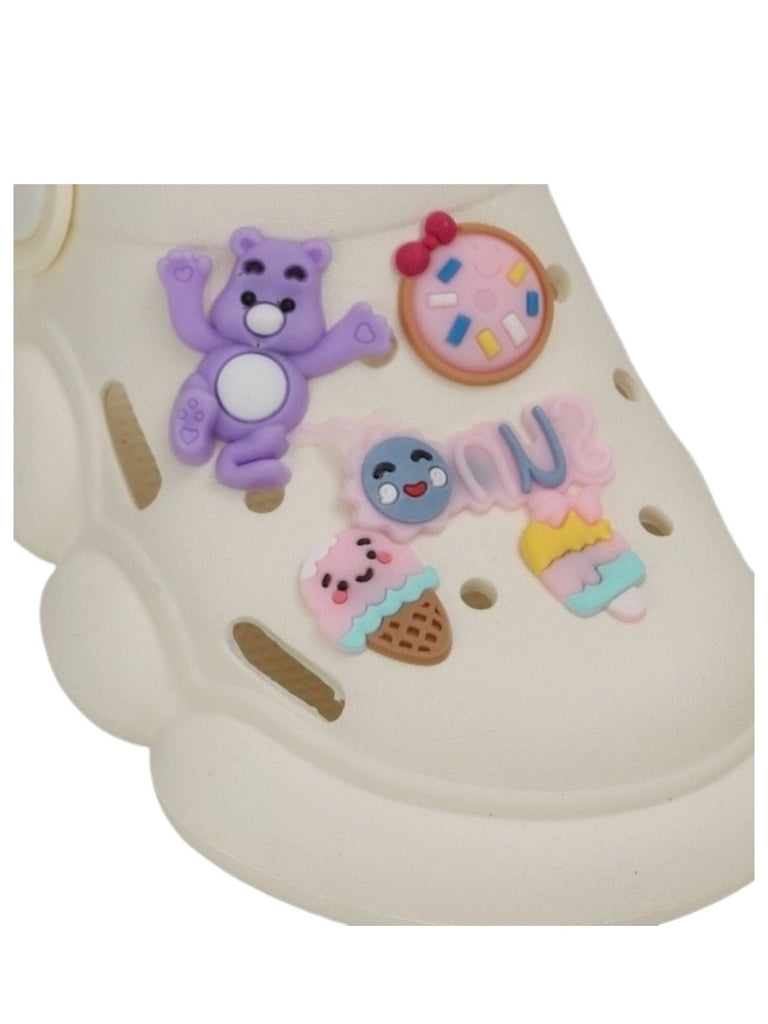 Zoomed-in view of the charm detail on Toddler Fantasy Clogs, featuring a bear and dessert motifs.