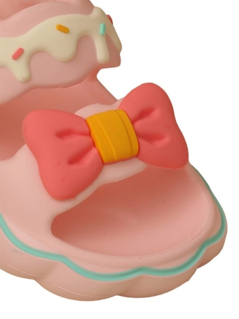 close up view of Yellow Bee Pink Bow Delight Sandals For Girls focusing on the bow detail and rubber material.