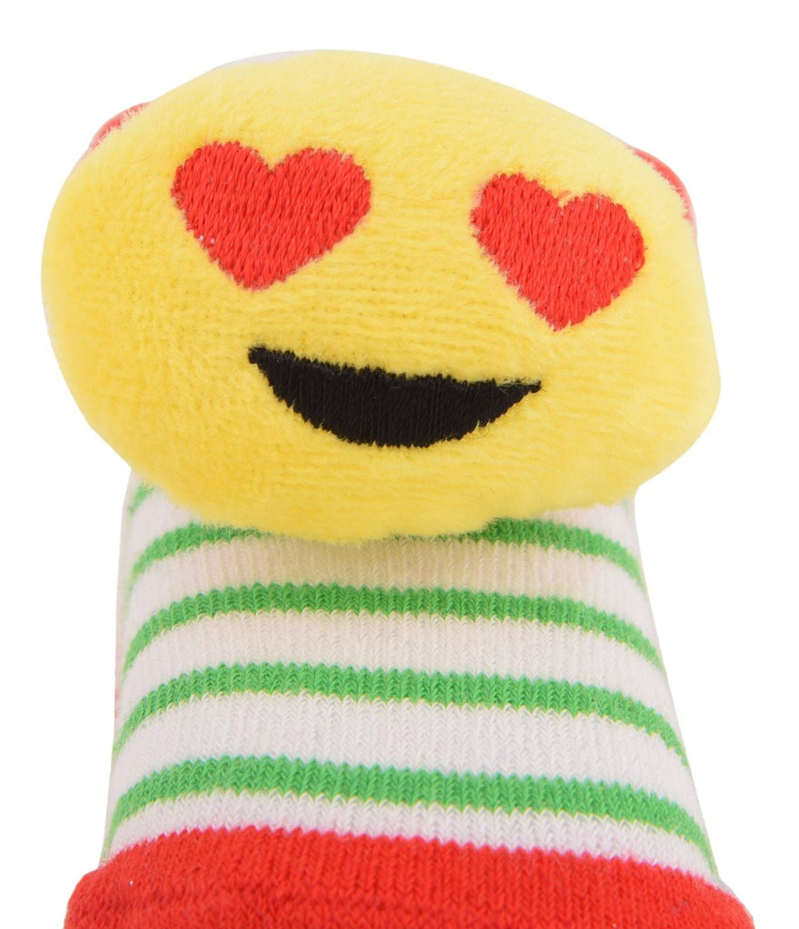 Close-up of yellow fuzzy socks with heart-eyes emoji design and colorful stripes