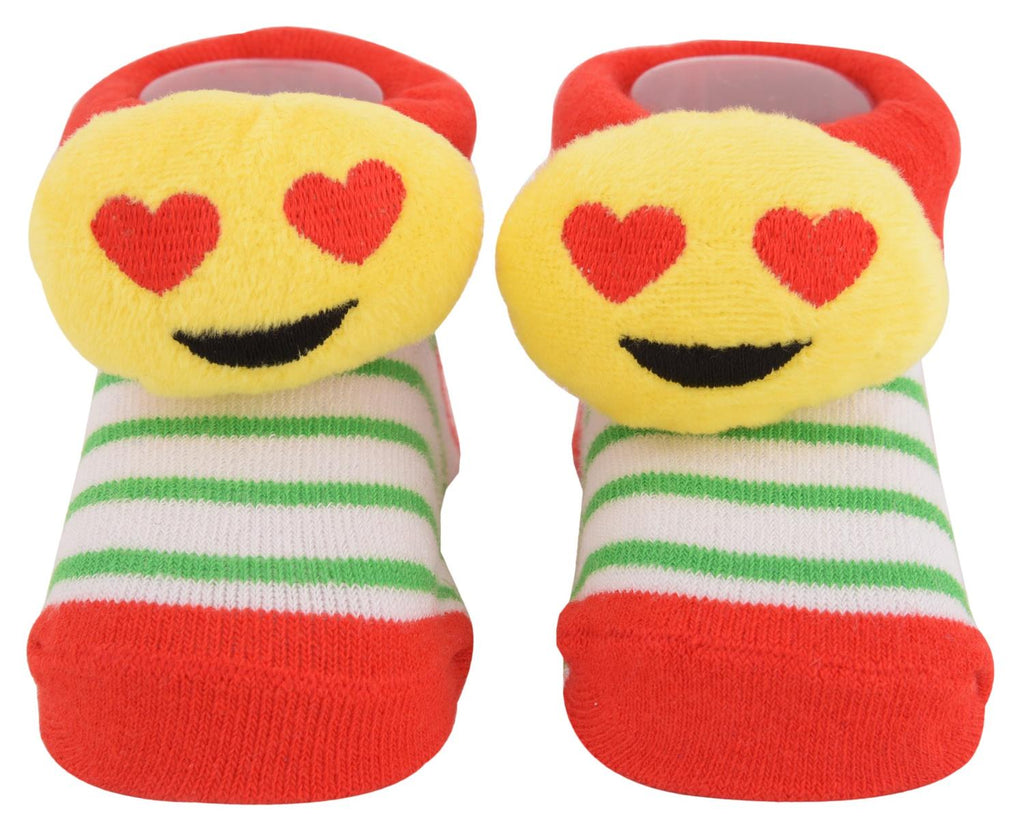 Top view of yellow love-struck emoji fuzzy socks with red and green stripes