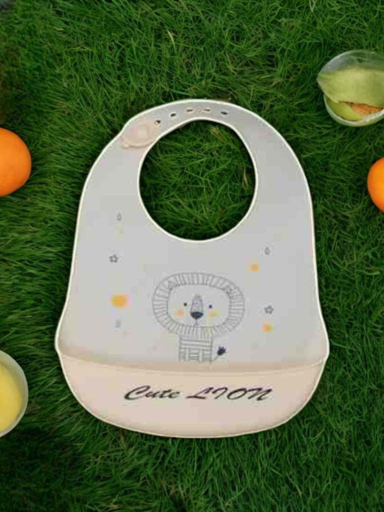 Creative display of the Cheerful Lion Silicone Baby Bib for Boys showing the full design.