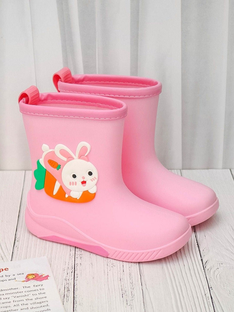 Creative display of Cheerful Pink Bunny Rain Boots in a playful environment.