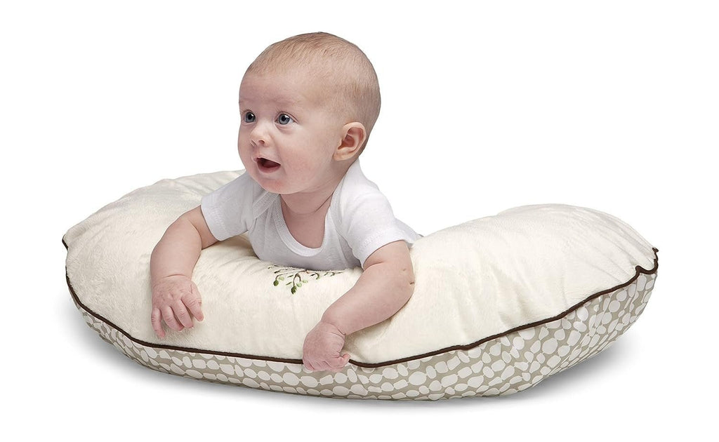 Full view of Chicco Boppy Feeding Pillow with Slipcover in Cream Life Tree design, with a baby.