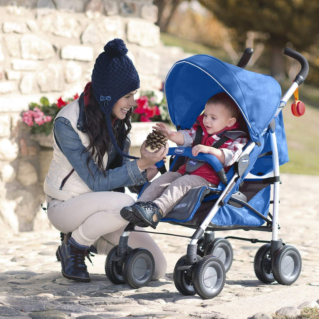 Mother using Chicco Multiway 2 Stroller in blue with toddler, highlighting comfortable seating and canopy.