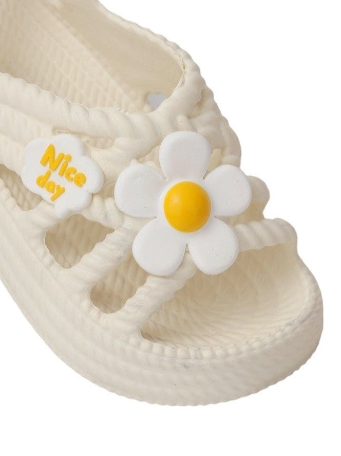 Close-up of the adorable flower charms on Yellow Bee's Cream-Colored Children's  Sandals