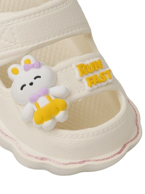 Close-up of Yellow Bee's sport sandal in cream with bunny characters and secure slingback