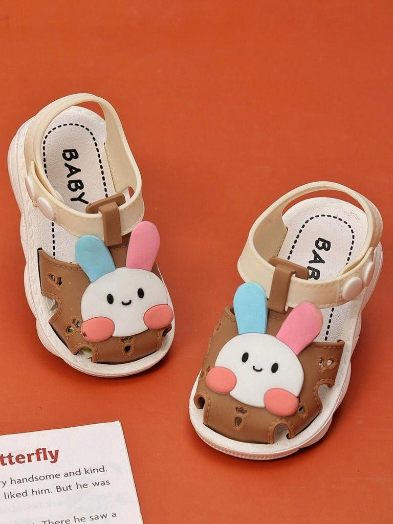 Creative display of Chocolate Brown Bunny Sandals with ear accents for girls by Yellow Bee