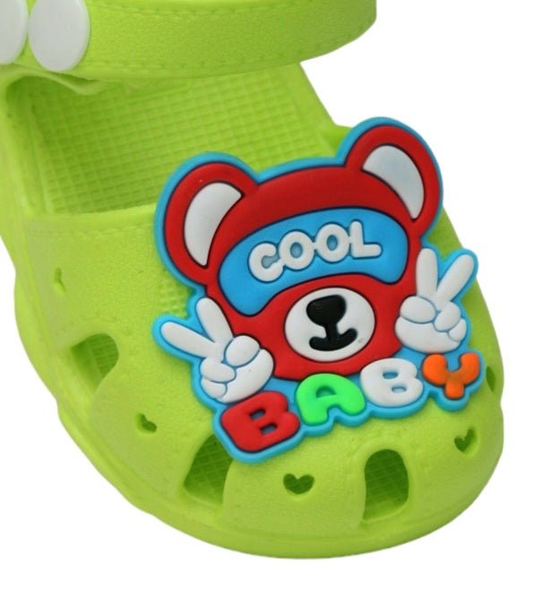 Close-up of the Cool Baby Bear decoration on green sandals