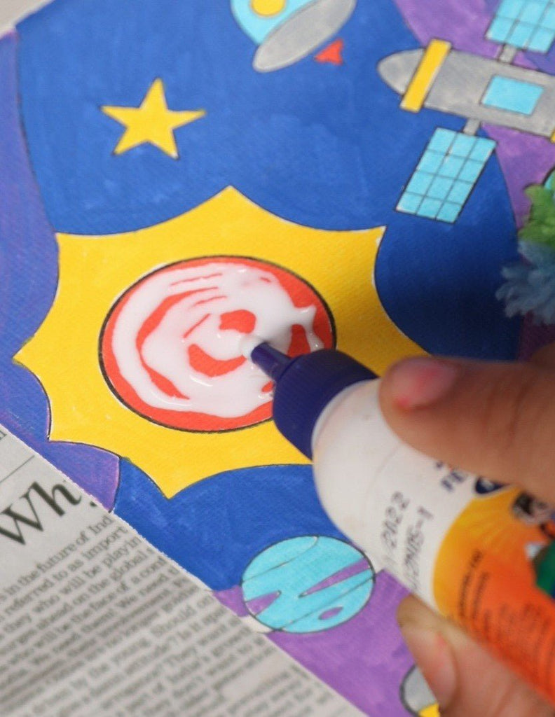 Child using the Yellow Bee Cosmic Adventure DIY Astronaut Art Kit, focusing on creative details.