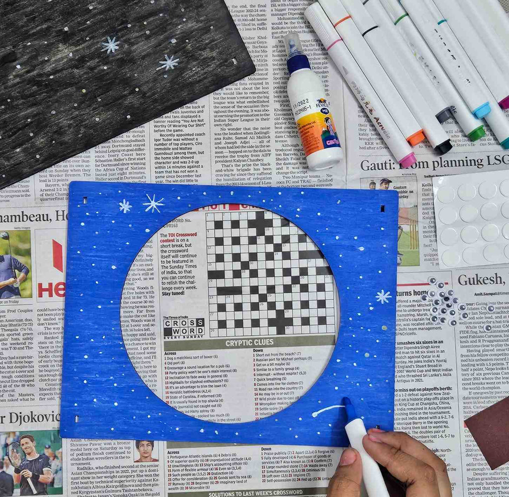 Child engaging with the Cosmic Explorers DIY 3D Light Box Kit, assembling the vibrant space scene.