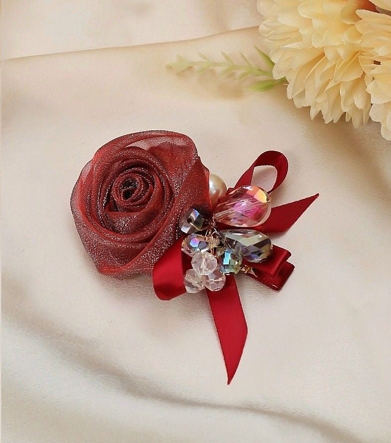 Yellow Bee's Red Rosette and Bow Hair Clip on Wooden Backdrop - Timeless Accessory for Elegant Events