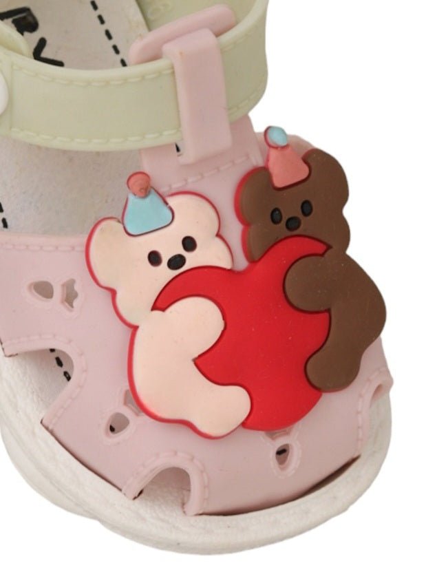 Close-up view of the cuddly bear detail on the Soft Pastel Sandals for girls