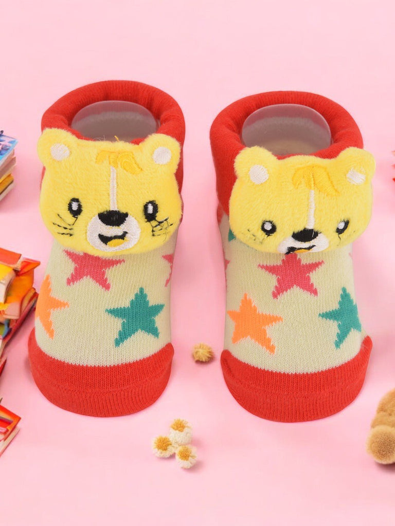 Pair of yellow bear stuffed toy socks for infants