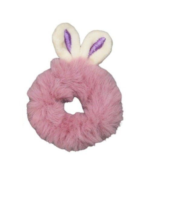 A top view of Yellow Bee's bunny ear fur scrunchies, capturing the soft fur texture and muted colors, a sweet hair accessory for any young girl's collection.