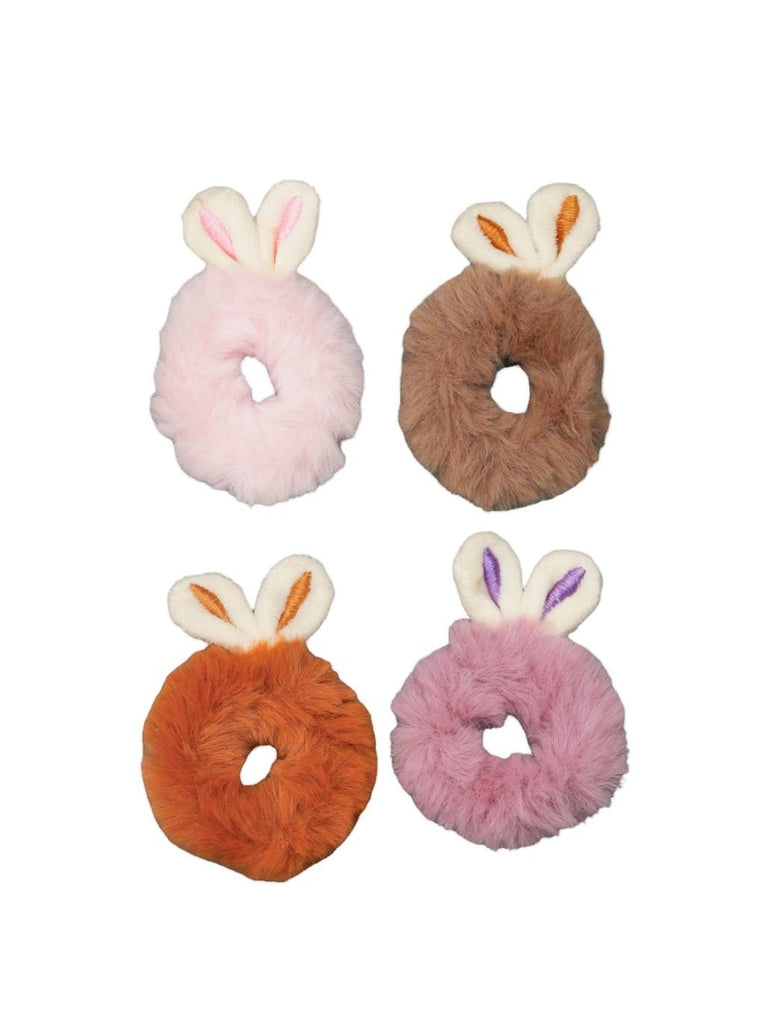 Yellow Bee's bunny ear scrunchies in a neutral palette featuring brown, beige, purple, and peach, presented in an isolated view to emphasize their fluffy texture and adorable ear details.