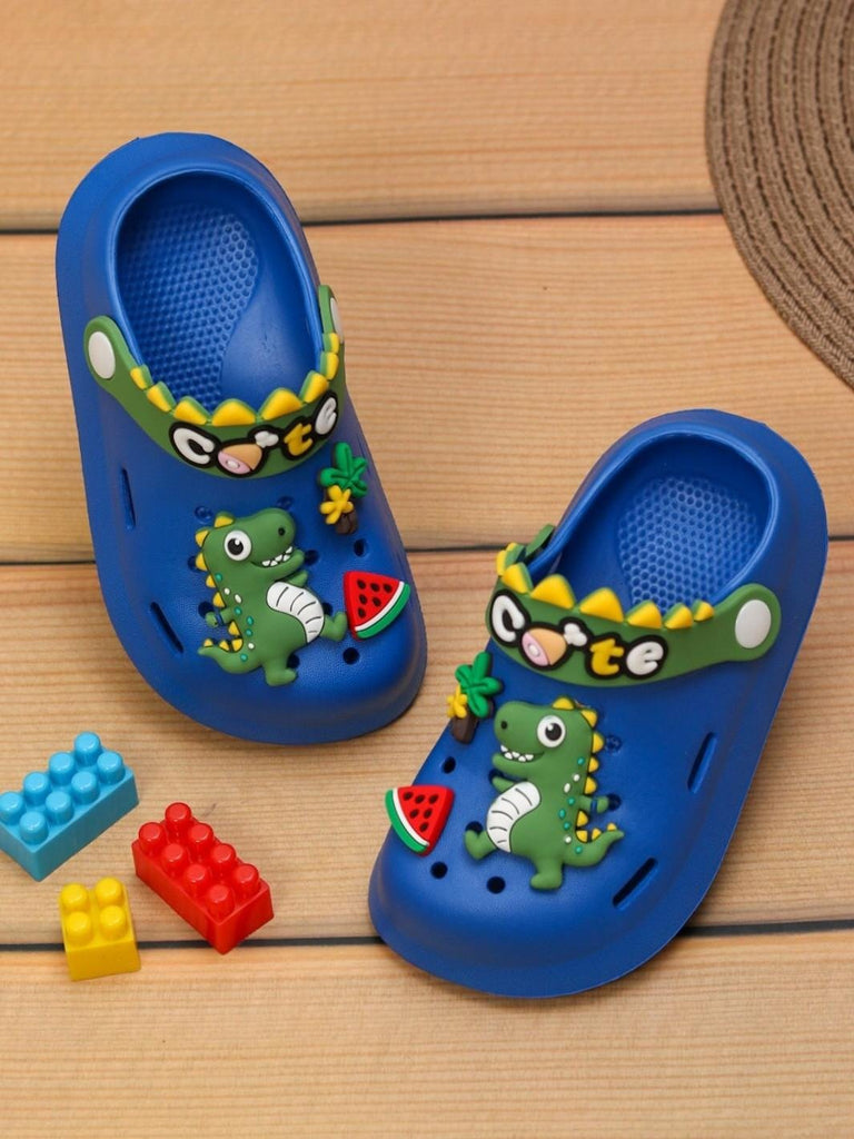 Creative display of Yellow Bee Cute Dino Fun Slip-On Clogs for Boys, Blue with playful setting