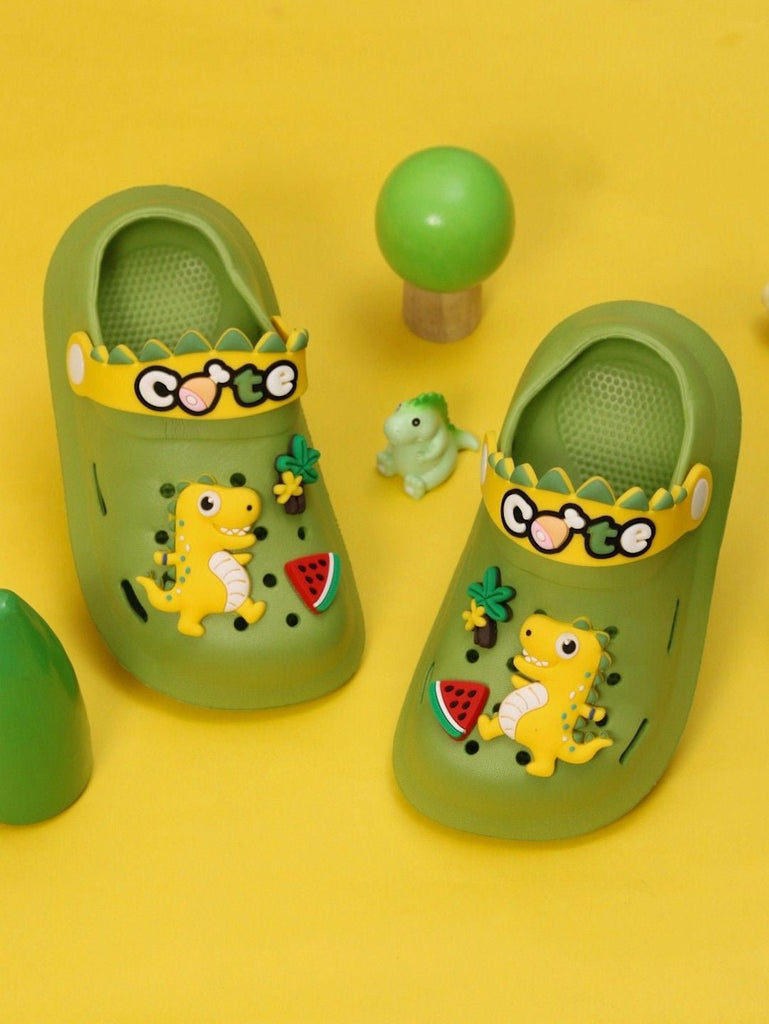 Creative setting displaying Yellow Bee Cute Dino Theme Slip on Clogs for Boys, Green