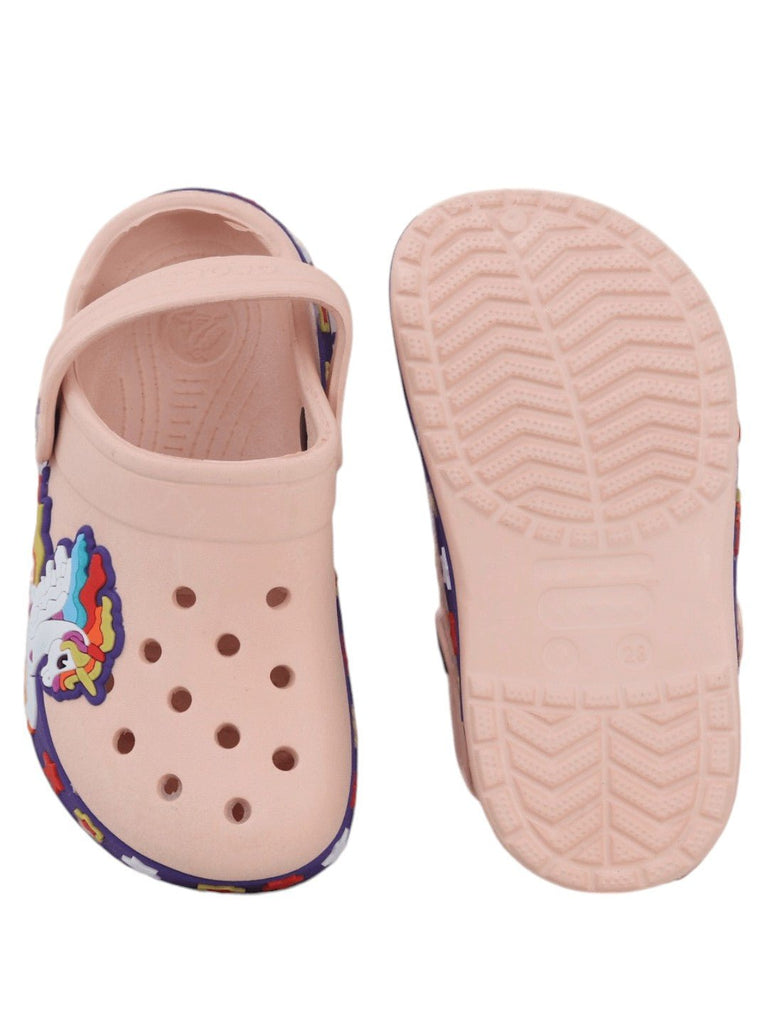 Overhead and sole view of peach-colored kids' clogs with unicorn detailing, illustrating the anti-slip tread