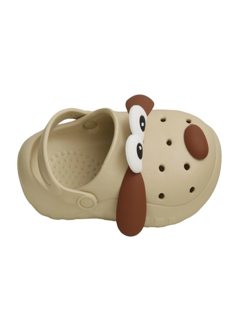 upper view of Yellow Bee Children's Puppy-Themed clogs with toy and cookies.